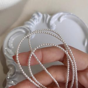 Elegant Layered Pearl Necklace - Light Luxury Collarbone Chain Accessory, French Design, Perfect for Stylish Layering and Chic Looks