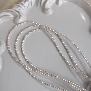 Elegant Layered Pearl Necklace - Light Luxury Collarbone Chain Accessory, French Design, Perfect for Stylish Layering and Chic Looks