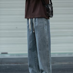Loose Water-Washed Denim Harem Pants for Men - Trendy Drawstring Design, Draping Effect, Versatile Hong Kong Style