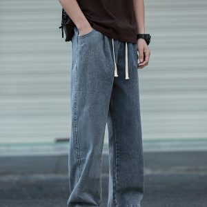 Loose Water-Washed Denim Harem Pants for Men - Trendy Drawstring Design, Draping Effect, Versatile Hong Kong Style