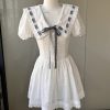 Navy Puff Sleeve Dress with French Bow Tie Strap and Waist-Cinching Design - Everyday Heavy Industry Style