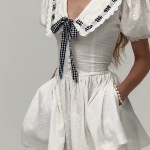 Navy Puff Sleeve Dress with French Bow Tie Strap and Waist-Cinching Design - Everyday Heavy Industry Style