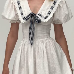 Navy Puff Sleeve Dress with French Bow Tie Strap and Waist-Cinching Design - Everyday Heavy Industry Style
